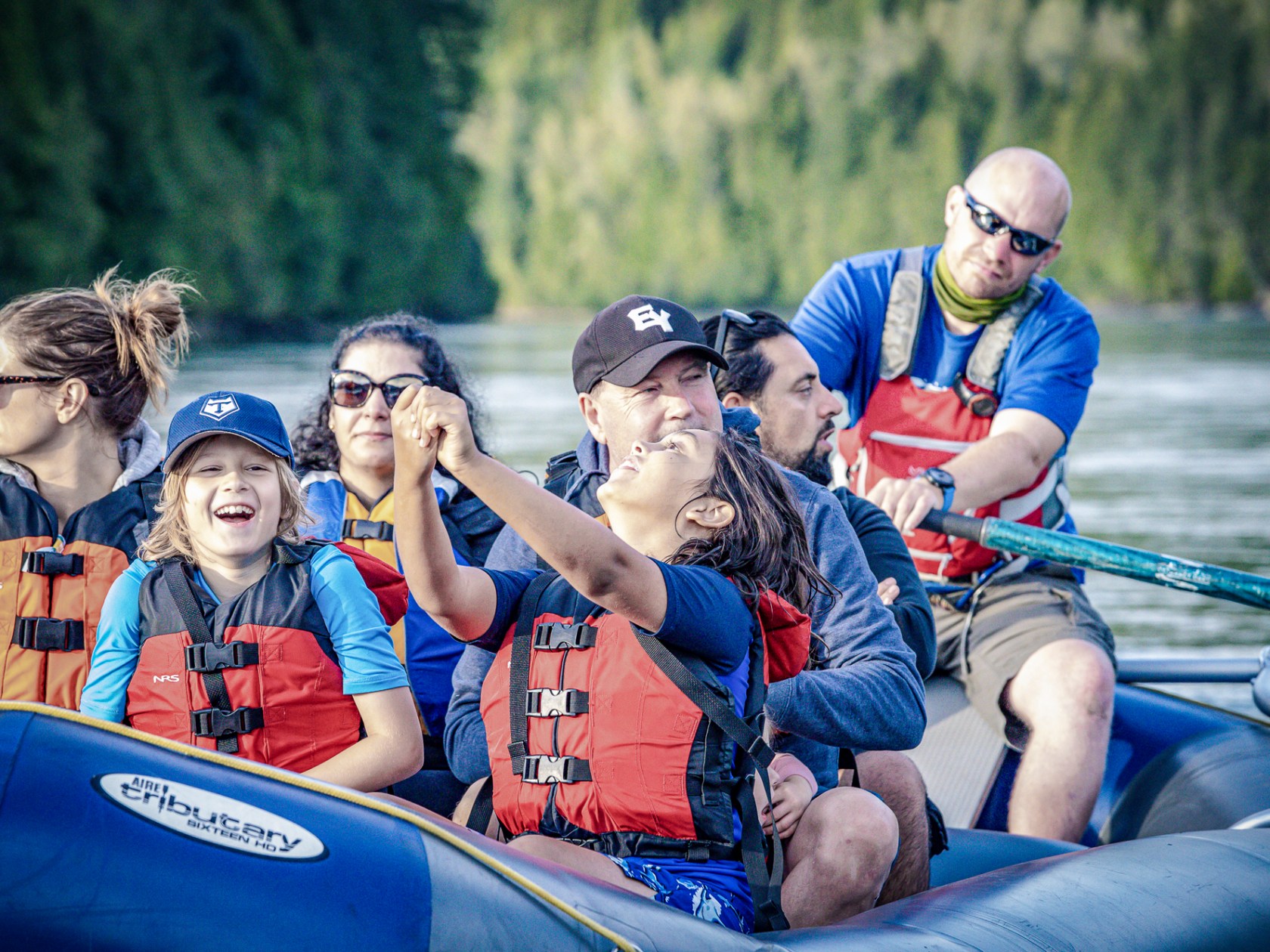 a group of people riding on the back of a boat